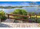 Landscaped backyard leading to lake views at 7226 Bryce N Pt, Pinellas Park, FL 33782