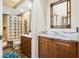 This bathroom includes marble countertop vanities, a shower, and a view to the hall at 7226 Bryce N Pt, Pinellas Park, FL 33782