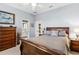 Bedroom features a dresser, bed, and connecting doorway to the bathroom at 7226 Bryce N Pt, Pinellas Park, FL 33782