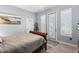 Bedroom featuring plantation shutters and neutral colors at 7226 Bryce N Pt, Pinellas Park, FL 33782