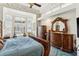 Bedroom features tray ceilings, large windows, and detailed wood furniture at 7226 Bryce N Pt, Pinellas Park, FL 33782