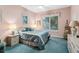 Comfortable bedroom with soft pink walls, a ceiling fan, and a large window with plantation shutters at 7226 Bryce N Pt, Pinellas Park, FL 33782