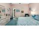 Inviting bedroom showcases ample storage with integrated cabinets and a glimpse into an adjoining room at 7226 Bryce N Pt, Pinellas Park, FL 33782