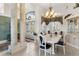Elegant dining room with a chandelier, large windows, and stylish furniture at 7226 Bryce N Pt, Pinellas Park, FL 33782