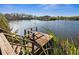 Wooden dock and steps leading to the lake at 7226 Bryce N Pt, Pinellas Park, FL 33782
