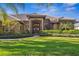 Charming home featuring a covered entryway with beautiful landscaping, and double doors at 7226 Bryce N Pt, Pinellas Park, FL 33782