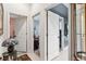 Hallway featuring several doorways leading to various rooms, with decorative lighting and tile flooring at 7226 Bryce N Pt, Pinellas Park, FL 33782