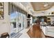 Bright and airy living space with a fireplace, stylish furniture, and seamless indoor-outdoor flow at 7226 Bryce N Pt, Pinellas Park, FL 33782