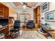 Office with wooden floors and wooden built in cabinets, comfortable seating and great decor at 7226 Bryce N Pt, Pinellas Park, FL 33782