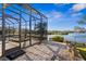 Screened pool area with spa overlooking lake and fountain at 7226 Bryce N Pt, Pinellas Park, FL 33782