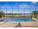 Screened in pool and patio area overlooking lake at 7226 Bryce N Pt, Pinellas Park, FL 33782