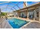 The enclosed lanai features a private in-ground pool and a large covered patio at 7226 Bryce N Pt, Pinellas Park, FL 33782
