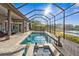 Screened pool and patio with lake view and sun at 7226 Bryce N Pt, Pinellas Park, FL 33782