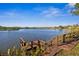 Scenic waterfront view with a private dock on a calm lake, perfect for relaxation and recreation at 7226 Bryce N Pt, Pinellas Park, FL 33782