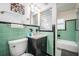 Bathroom with original green tile, a black vanity, and natural light at 841 4Th N Ave # 57, St Petersburg, FL 33701