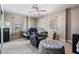 Bedroom with two twin beds, ceiling fan, and a comfortable chair at 841 4Th N Ave # 57, St Petersburg, FL 33701