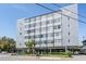 View of six-story building exterior showcasing windows and gray siding over parking entrance at 841 4Th N Ave # 57, St Petersburg, FL 33701