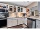Updated kitchen featuring stainless steel appliances and bright white cabinets with granite countertops at 841 4Th N Ave # 57, St Petersburg, FL 33701