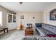 Relaxing living room with a comfortable gray couch and a unique coffee table at 841 4Th N Ave # 57, St Petersburg, FL 33701