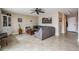 Comfortable living room with gray sectional sofa, a unique coffee table, and a built-in bookcase at 841 4Th N Ave # 57, St Petersburg, FL 33701
