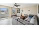 Comfortable living room with gray sectional sofa, unique coffee table, and view to outside at 841 4Th N Ave # 57, St Petersburg, FL 33701