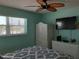 Bedroom with a queen-size bed, white furniture and a window offering natural light at 8567 W Gulf Blvd # 17N, Treasure Island, FL 33706