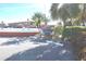 A view of the community's pool and sign providing an overview of the condo's amenities, location and parking at 8567 W Gulf Blvd # 17N, Treasure Island, FL 33706