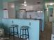 Well-equipped kitchen with white cabinets, granite countertops, and stainless steel appliances at 8567 W Gulf Blvd # 17N, Treasure Island, FL 33706