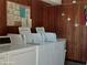On-site laundry room featuring rows of clean, efficient washing machines for resident convenience at 8567 W Gulf Blvd # 17N, Treasure Island, FL 33706