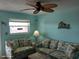 Living room with couches and ceiling fan at 8567 W Gulf Blvd # 17N, Treasure Island, FL 33706