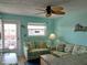 Living room with couches and ceiling fan at 8567 W Gulf Blvd # 17N, Treasure Island, FL 33706