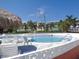 Enjoy the community pool, equipped with seating, easy access, and sparkling waters at 8567 W Gulf Blvd # 17N, Treasure Island, FL 33706