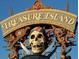 Treasure Island sign with a pirate skull, creating a playful and adventurous atmosphere at 8567 W Gulf Blvd # 17N, Treasure Island, FL 33706