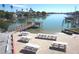 Scenic waterfront featuring picnic tables, docks and bay access, ideal for outdoor gatherings and water activities at 8567 W Gulf Blvd # 17N, Treasure Island, FL 33706