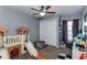 Fun bedroom featuring closet, playful toys, and a neutral color palette at 8713 Hampden Dr, Tampa, FL 33626