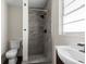 Modern bathroom featuring tiled walk-in shower with a black shower head at 9307 N 27Th St, Tampa, FL 33612