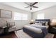 Charming bedroom features an area rug and accent chair by the window at 9307 N 27Th St, Tampa, FL 33612