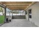 View of a covered porch area with a view to the backyard at 9307 N 27Th St, Tampa, FL 33612