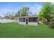 A screened-in porch enhances outdoor living at 9307 N 27Th St, Tampa, FL 33612
