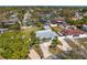 Aerial view of a single-story home with a lush backyard and beautiful landscaping in a residential neighborhood at 1003 39Th Ne Ave, St Petersburg, FL 33703