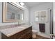Clean bathroom with granite countertop vanity and a large mirror at 1003 39Th Ne Ave, St Petersburg, FL 33703