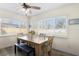 Sun-lit dining area with large windows, wood table, and bench seating at 1003 39Th Ne Ave, St Petersburg, FL 33703