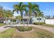 Inviting single-story home with tropical landscaping, a circular driveway, and a serene curb appeal at 1003 39Th Ne Ave, St Petersburg, FL 33703