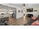 Open-concept living room with hardwood floors, modern decor, and a view into the kitchen at 1003 39Th Ne Ave, St Petersburg, FL 33703