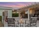 Relaxing outdoor patio area with stylish seating under a pergola and illuminated with string lights at 1003 39Th Ne Ave, St Petersburg, FL 33703