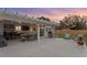 Spacious outdoor patio with a pergola, dining area, grill, and comfortable seating for entertaining at 1003 39Th Ne Ave, St Petersburg, FL 33703