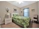 Inviting bedroom with tropical-themed décor and a comfortable bed with matching pillows and decor at 10213 Saint Francis Ter, Palmetto, FL 34221