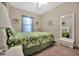 Inviting bedroom with tropical-themed décor and a comfortable bed with matching pillows and decor at 10213 Saint Francis Ter, Palmetto, FL 34221