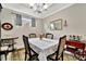 Cozy dining room with a floral tablecloth and traditional decor, perfect for intimate meals at 10213 Saint Francis Ter, Palmetto, FL 34221