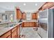 Kitchen with stainless appliances, granite countertops, and ample counter space at 10213 Saint Francis Ter, Palmetto, FL 34221